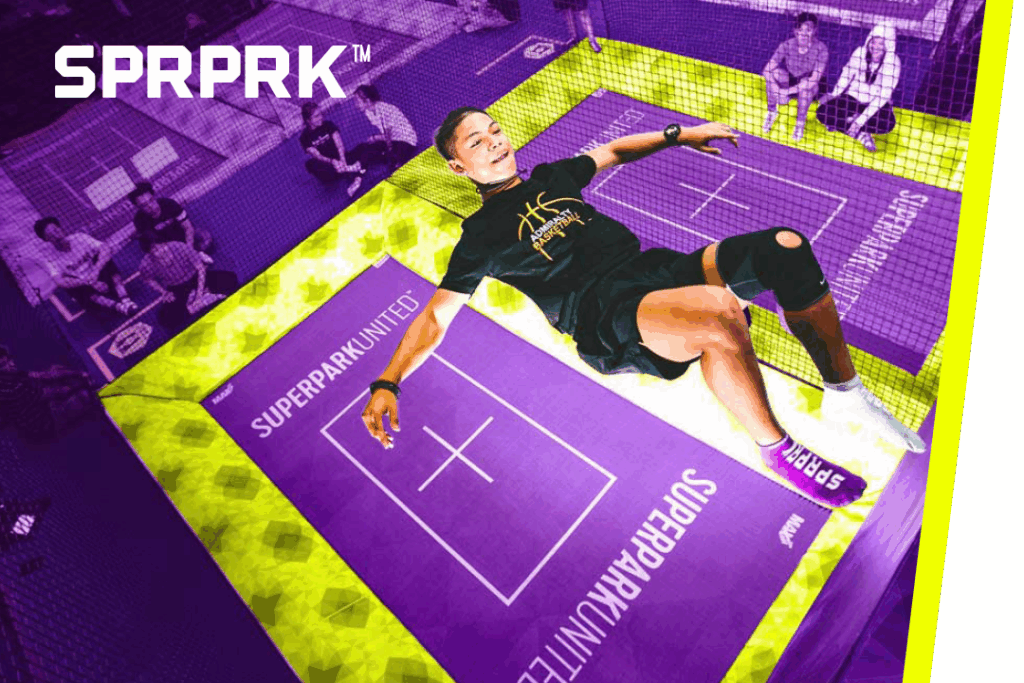 A young man bouncing on a trampoline with SPRPRK™ text